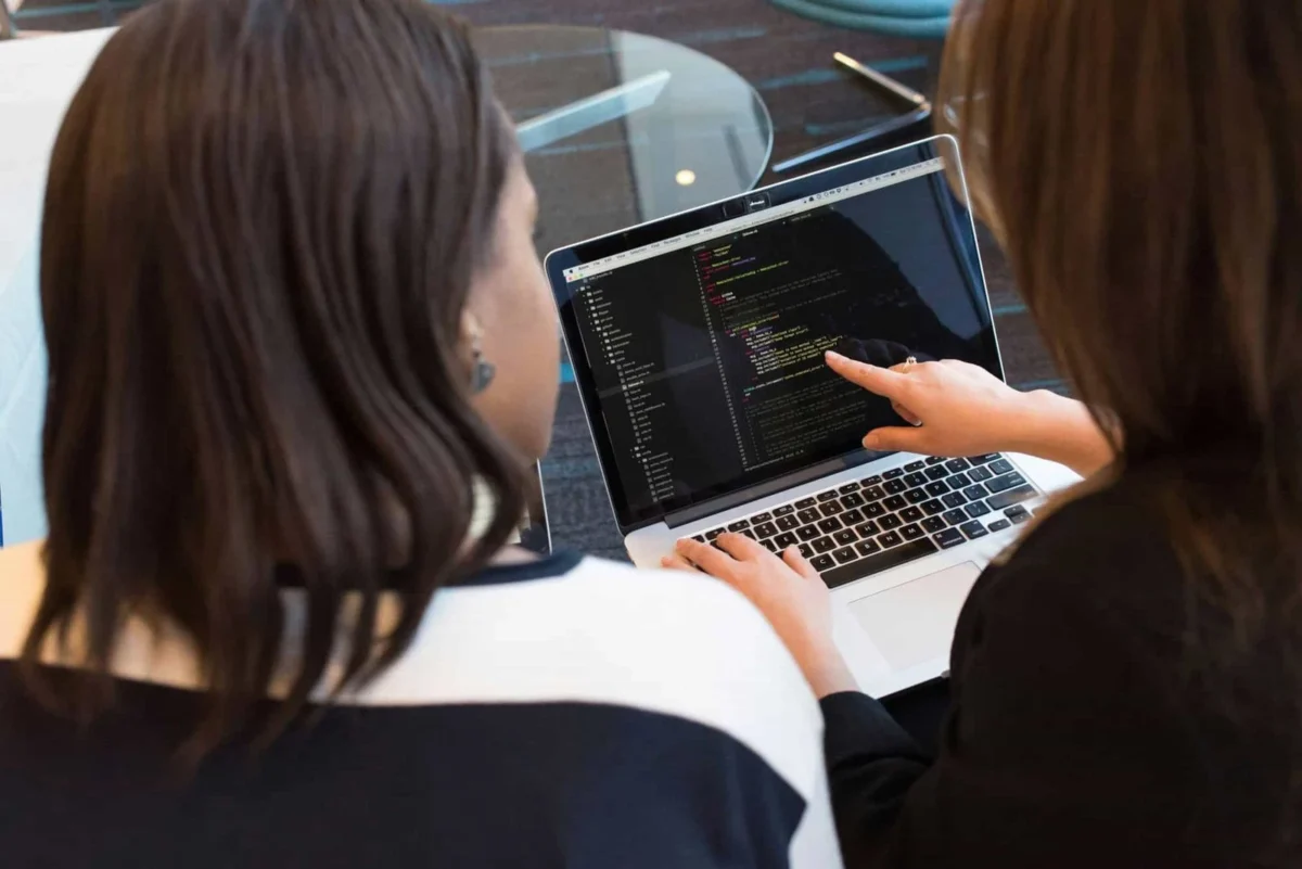 Web Designer in Adelaide discussing code with client for custom website development